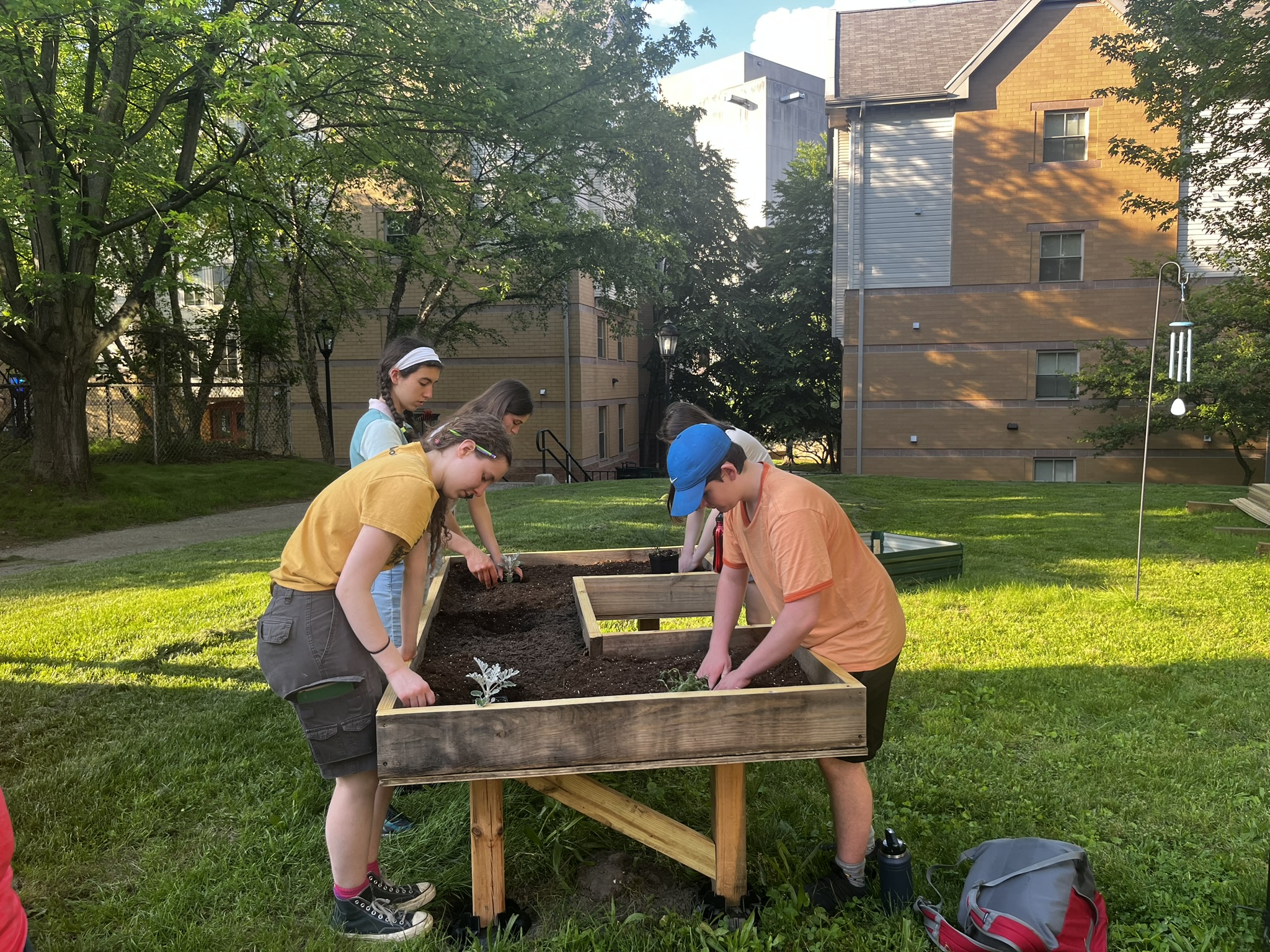 people working in HHL raised garden bed